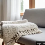 양모 이불 세탁법 - A cozy, sunlit German living room scene featuring a soft, fluffy wool blanket draped neatly over a m...